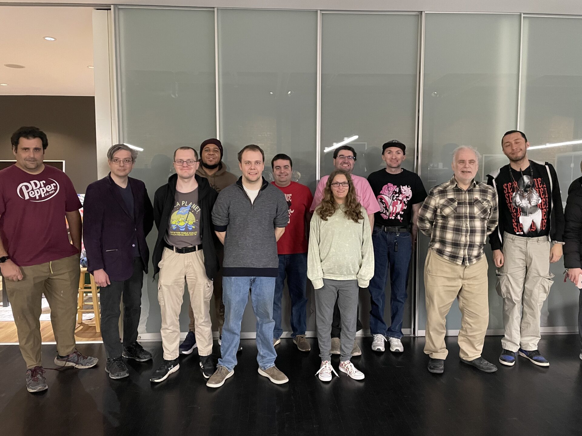 A group photo of Aspiritech employees and community members. 