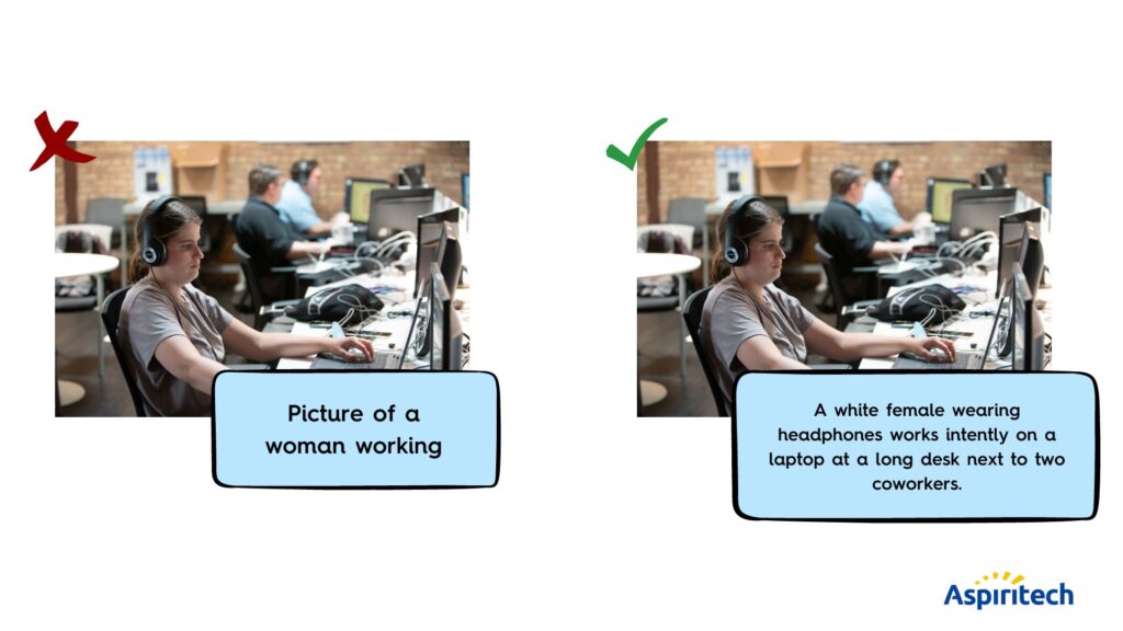 A white female wearing headphones works on a laptop at a long desk next to coworkers.