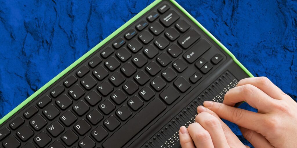 Two hands on a black Braille display keyboard with a lime green border, set against a stone-textured blue graphic background.