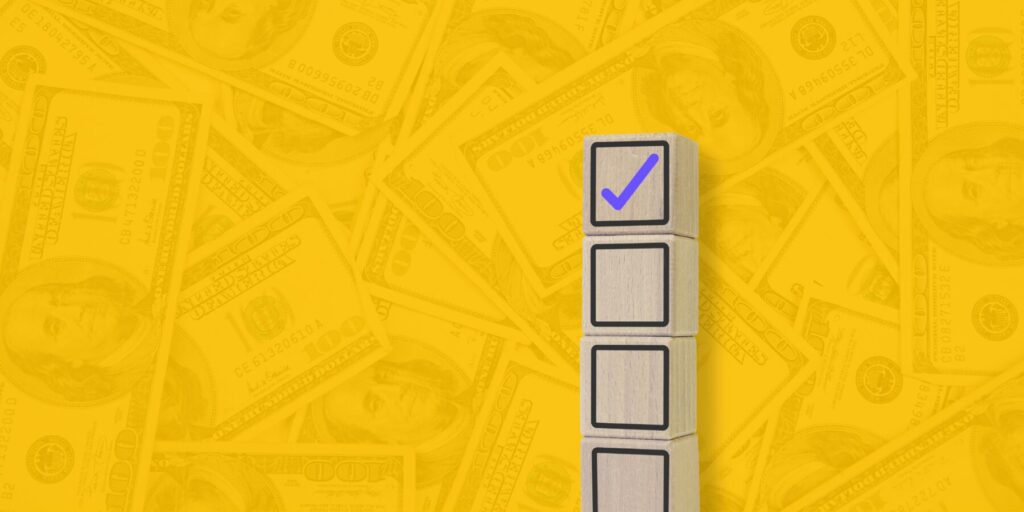 Stacked toy-like blocks representing software QA, with a top purple checkmark block symbolizing verified quality, on a yellow background with subtle $100 bill texture representing ROI.